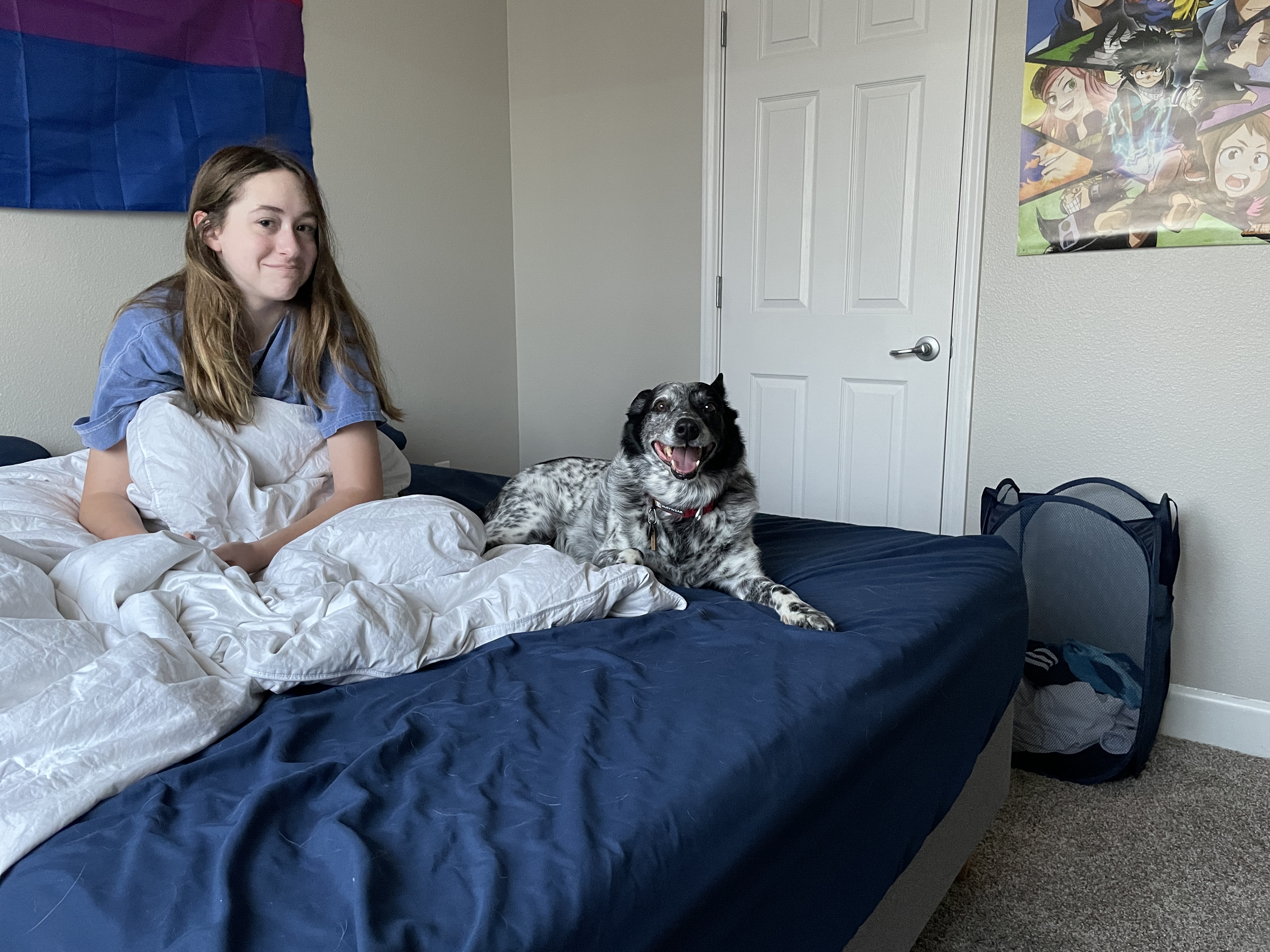 Banzai smiling on a bed beside his family.
