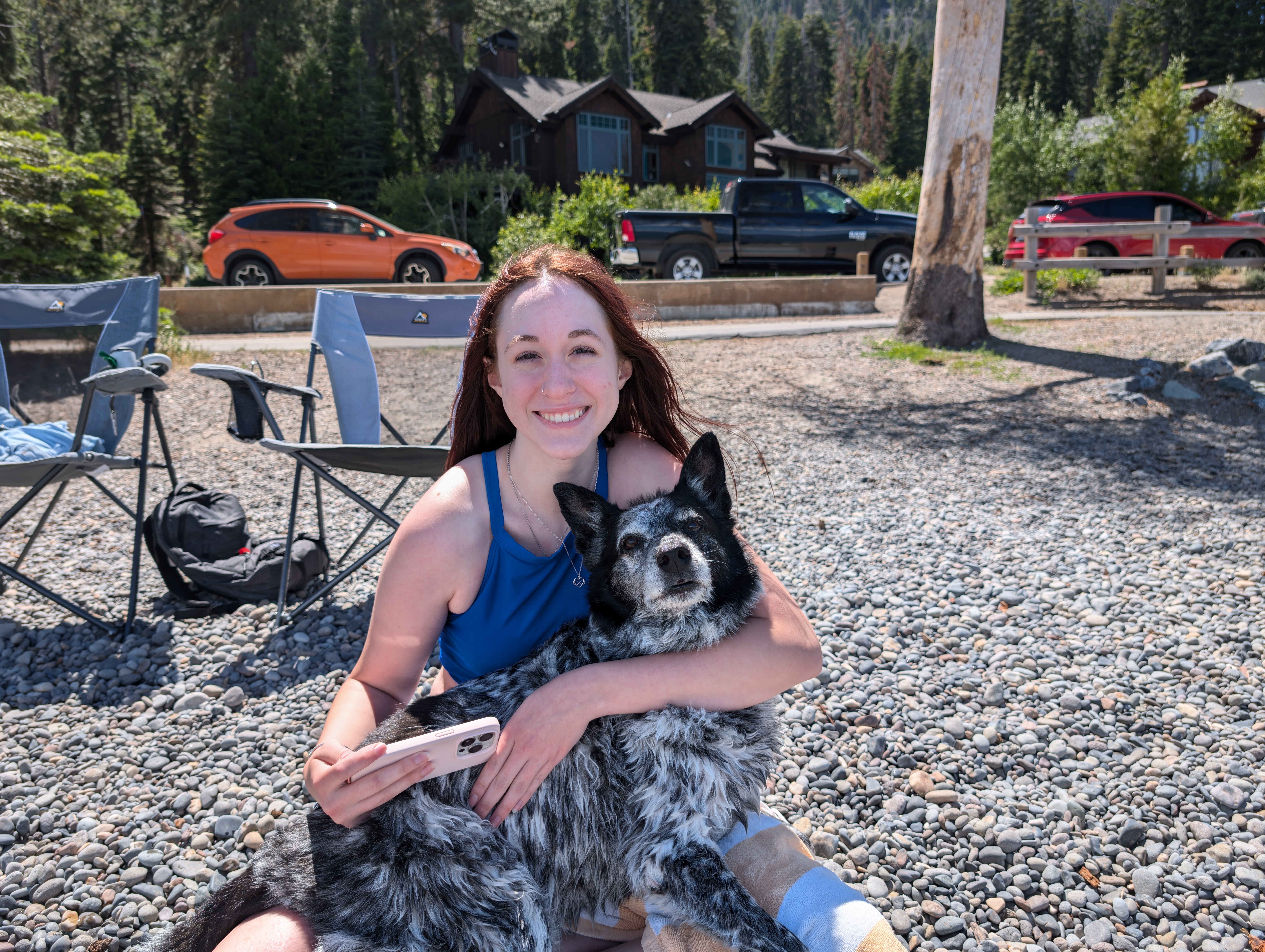 Banzai being hugged outside in the sun.